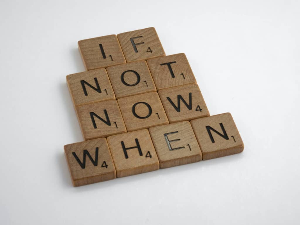 Scrabble tiles showing: If not now, when